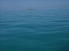 Heron Island as viewed from a distance at high tide. The island is located approximately 540 km north of Brisbane.